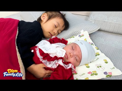 Diem was so affectionate hugging his little sister while she slept