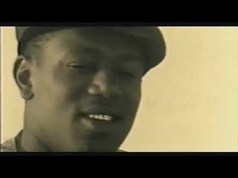 Trailer frame: streetlight flare over a parked Chevy; the sound drops to a moody synth bed