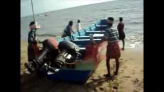preview picture of video 'Kerala fishermen taking their boat from land to water'