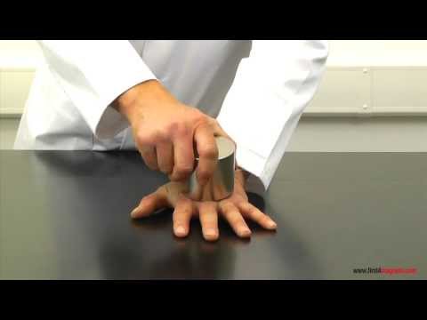 Super-strong neodymium magnets crushing a man's hand