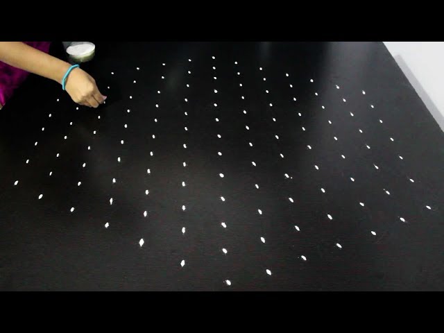 Big dotted rangoli design by rangoli latest designs