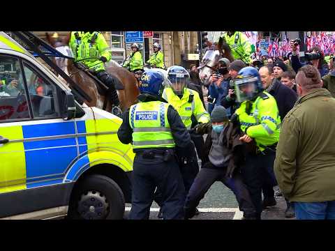 Britain First march through Manchester as counter protest clash with police