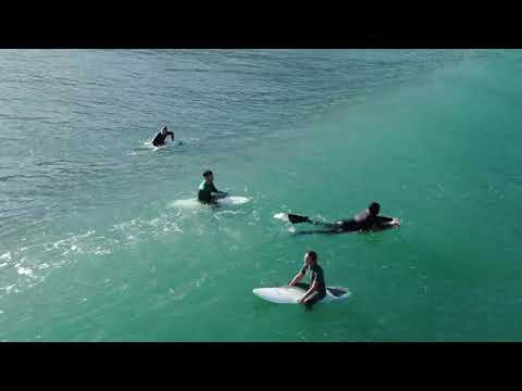 Drone footage of surfers and waves at Etretat 