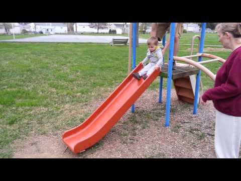 Chad and Sean at the park playing on the slide
