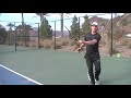Brian Battistone hitting 2 forehands with the two-handled tennis racket