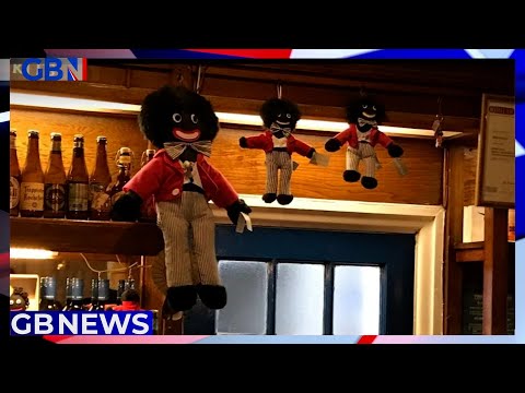 Couple vow to put their offensive golliwog dolls back on display after they were seized by police