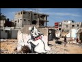 Street art of Banksy in Palestine with David Rovics singing "Occupation" Video by Eitan Altman