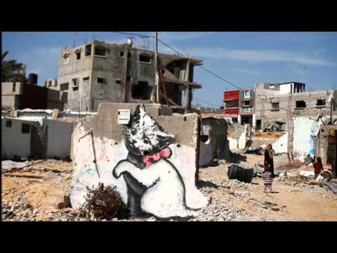 Street art of Banksy in Palestine with David Rovics singing 