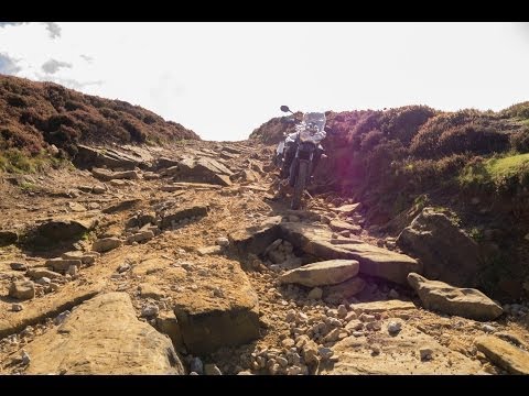 Riding my Tiger 800 down the steps on Rudland Rigg