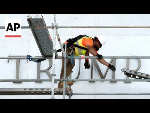 Timelapse of workers covering signage at the Kennedy Center before removing Trump's name
