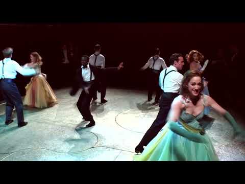 Orchestra pit view and terrace set piece—visual cue for swing numbers and waltzes