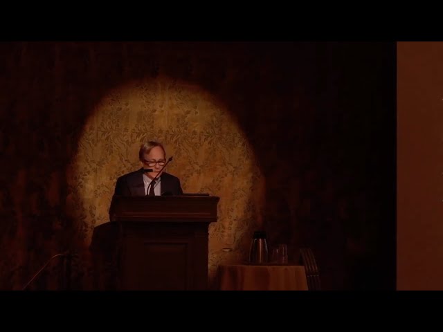 Man standing behind a podium