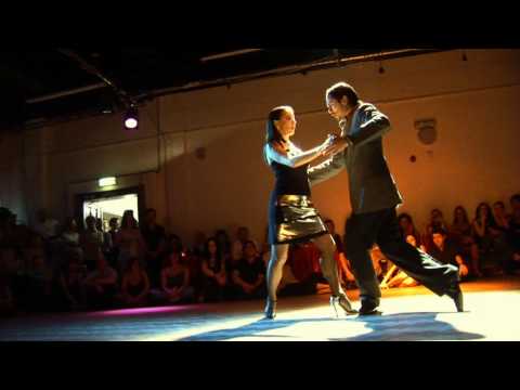  David Alejandro Palo  and  Milena Plebs  are  dancing  to  a  tango