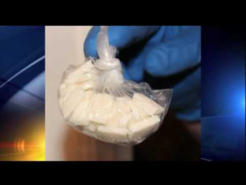 K9 detects 2lbs marijuana, 1oz crack, $20k cash and loaded rifle inNorth Port Home