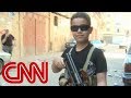 Child fighter with AK 47 on Syria border