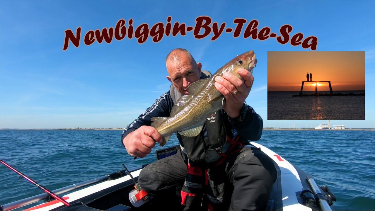 Man on a SIB holding his catch towards the camera