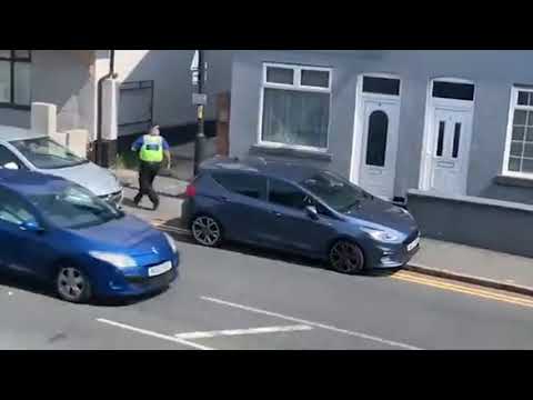 moment man leaps from roof of two-storey building 'in bid to get away from police'