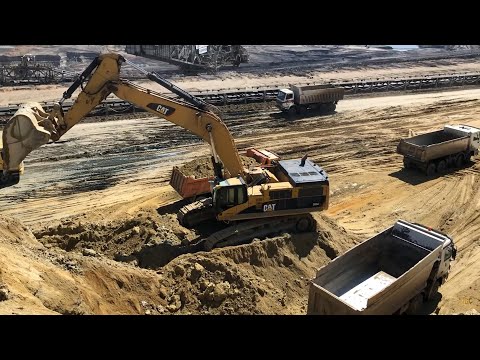 Caterpillar 385CL Excavator Loading Trucks - Kivos Ate