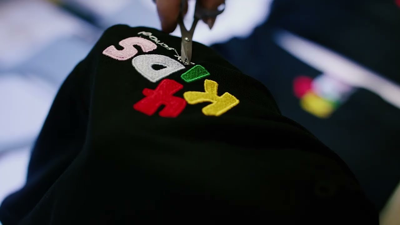 Embroidery on branded clothing — logo stitched directly into fabric for a premium lasting finish on workwear, polos and caps