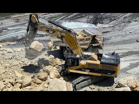 Caterpillar 385C Excavator Loading Caterpillar 775D Dumper And Trucks - Pyramis Ate