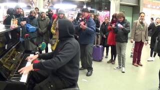 Crowd Digs Christmas Blues at a Public Piano