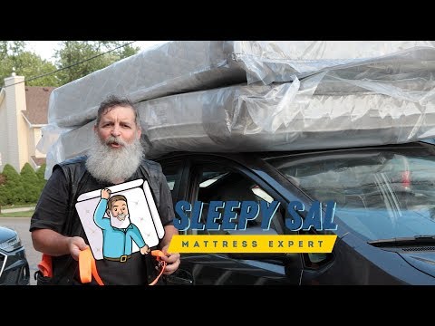 Part of a video titled How to transport a mattress safely on top of any car or suv - YouTube