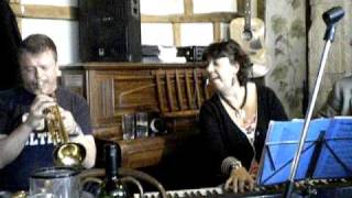 Denise Orita  singing "Fly me to the moon" in  Porters Wine bar hastings