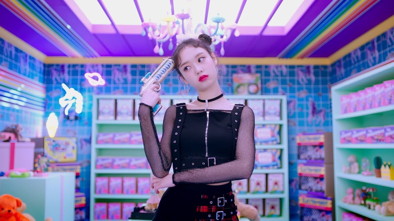 A FANATICS member on a toy-shop set in the music video for “VAVI GIRL”