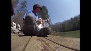 Jason chumley playing a lil mandolin by the lake.
