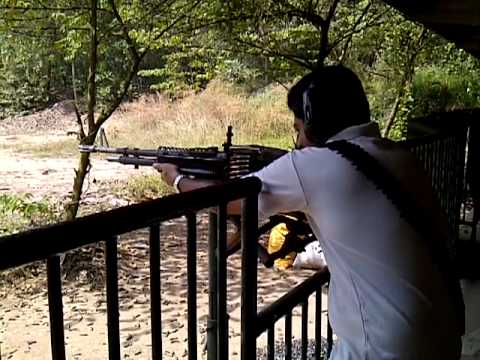 Spraying Bullets From A Machine Gun M60