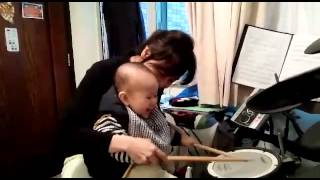 Collin first play drum with Mom