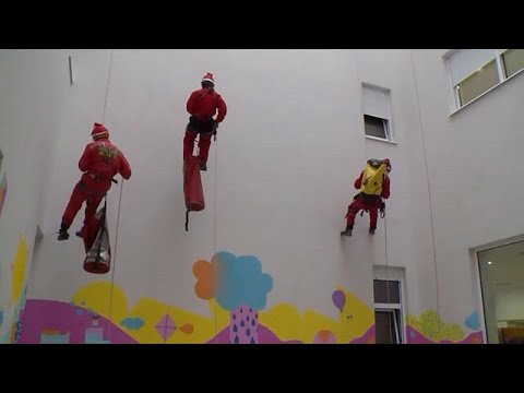 Video Thumbnail: Wall climbing Santa meets sick children