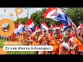 Oranjefans zingen, springen en dansen in de fanzone