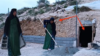 Concrete and blocks: Grandma's tools to build a security and beauty fence in front of the cave