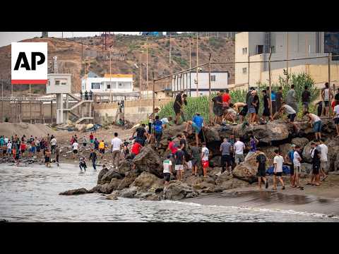 Video Thumbnail: People at Ceuta border fence as migrants try to reach Spanish territory