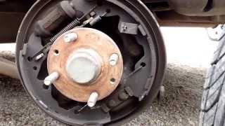 Brake sound 1998 Ford Escort - rear brake drum missing hardware