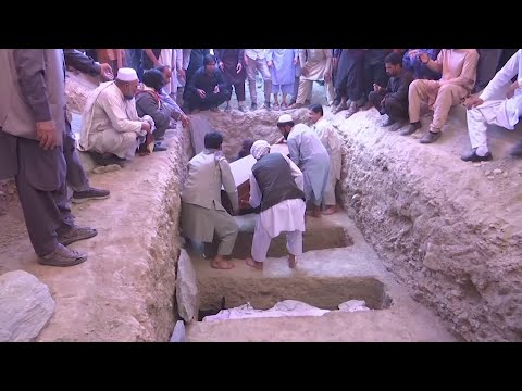 Relatives of those killed in the suicide bombing at a Kabul wedding on Saturday night began to bury the dead on Sunday. The Islamic State group's affiliate in Afghanistan has claimed responsibility for blast that killed at least 63 people. (August 18)