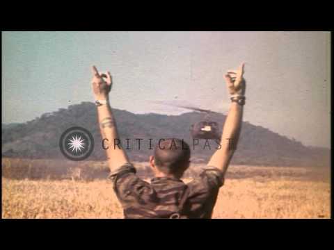 Montagnard and Australian soldiers receive supplies from a US Army UH-1 Iroquois ...HD Stock Footage