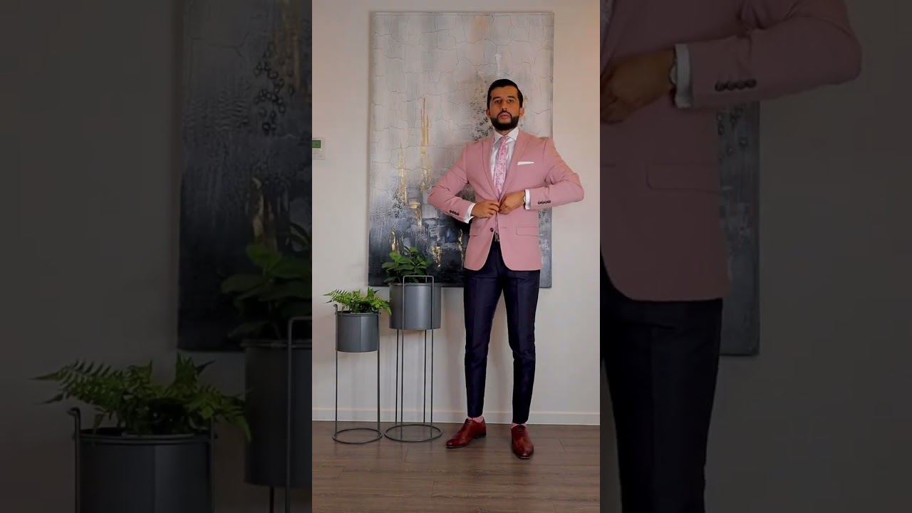 The pale pink blazer with the navy pants and brown details..