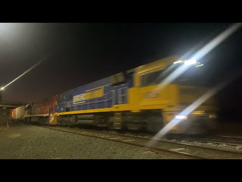 Up 2PM5 Pacific National freight with NR56 and NR110 (Ghan) at Gheringhap at night 27/3/2025