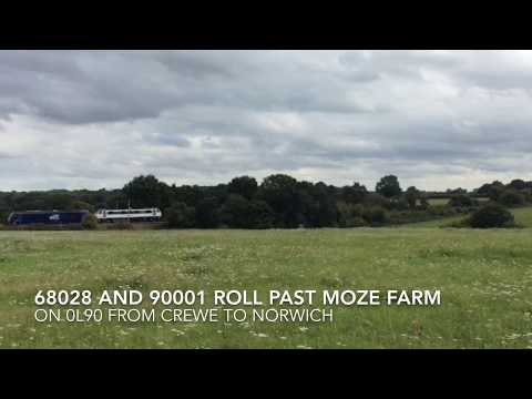 DRS 68028 and 90001 roll past Moze Farm on 0L90