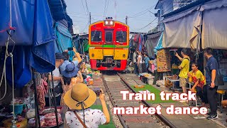 Experience the Amazing Umbrella Pulldown Market: Maeklong Railway Market in Thailand