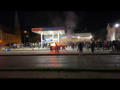 Protesters set dumpster on fire