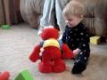 Baby Playing With Elmo