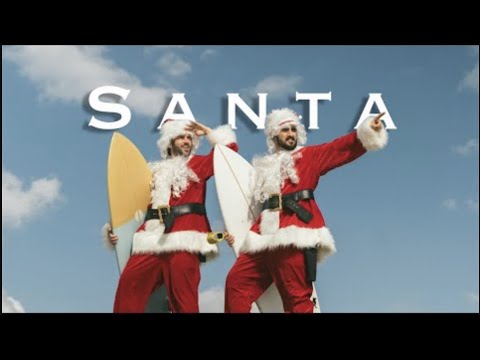 在加州威尼斯海灘扮聖誕老人衝浪 (Surfing as Santa Claus in Venice Beach California)