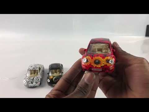 Металлическая машинка Kinsmart 1:32 «Volkswagen Beetle New (с принтом)» KT5062D инерционная / Белый