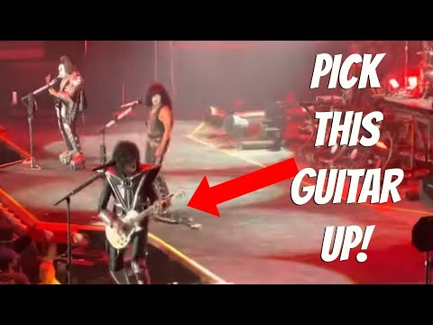 Paul Stanley is VERY upset with his guitar (and lips....)