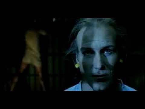 Trailer montage: gray prison palette cutting to glittering club light — a musical pivot point