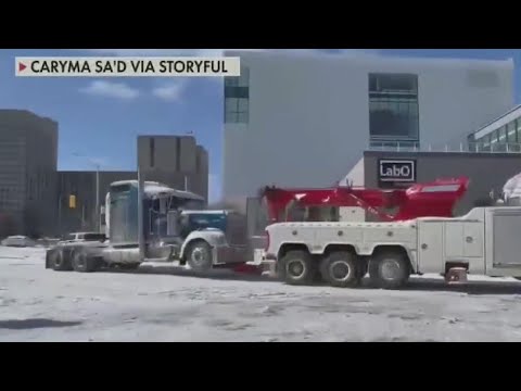 Police tow semitrucks, try to clear out 'freedom-convoy' protestors in Canada | FOX 7 Austin