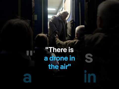 Drone alert - DW team films night-time evacuation of Ukrainian train | DW News